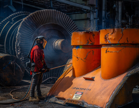 Photo of a worker inside a power station
