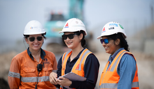 Photo of three female Delta Group employees